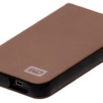 Disque dur portable en bronze et noir, connecteur USB visible